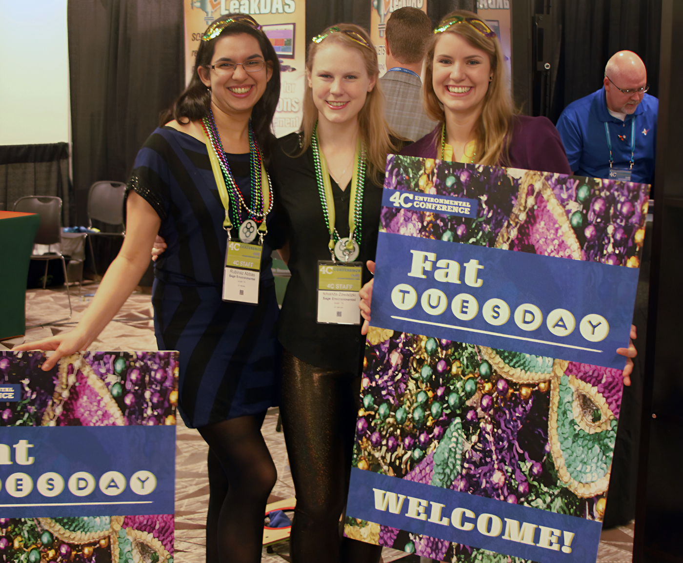 Volunteers holding some of the night event signs.